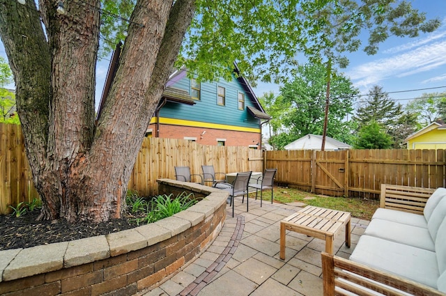 931 Dennison Ave, Columbus, OH 43201 - view of patio featuring an outdoor hangout area and a fenced backyard