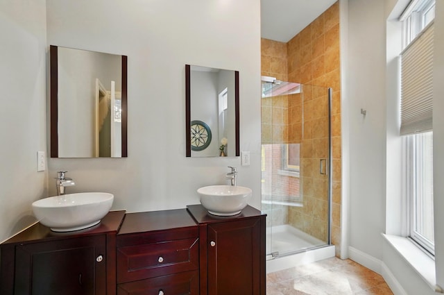 931 Dennison Ave, Columbus, OH 43201 - bathroom with a wealth of natural light, a stall shower, and a sink