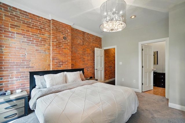 931 Dennison Ave, Columbus, OH 43201 - bedroom featuring carpet flooring, an inviting chandelier, brick wall, baseboards, and ornamental molding