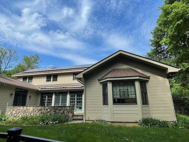 61 Wyddfa Ct, Granville, OH 43023 - view of front of home with solar panels and stone siding