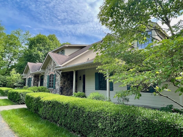 61 Wyddfa Ct, Granville, OH 43023 - view of home's exterior featuring stone siding and a porch