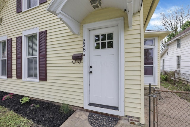 property entrance with fence