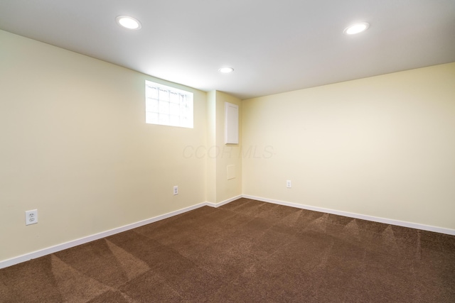 24 Brighton Rd, Columbus, OH 43202 - basement featuring dark colored carpet, baseboards, and recessed lighting