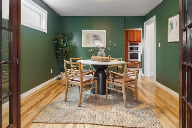 24 Brighton Rd, Columbus, OH 43202 - dining room featuring light wood-type flooring and baseboards