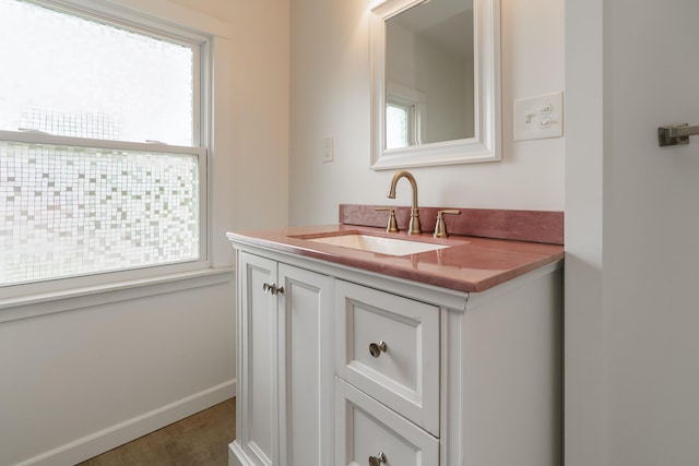 24 Brighton Rd, Columbus, OH 43202 - bathroom with healthy amount of natural light, vanity, and baseboards