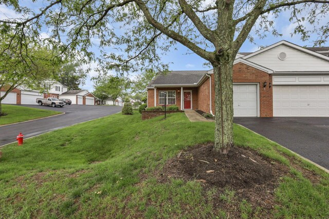 6010 Acropolis Way, Columbus, OH 43231 - view of front facade featuring brick siding, driveway, a front yard, and a garage
