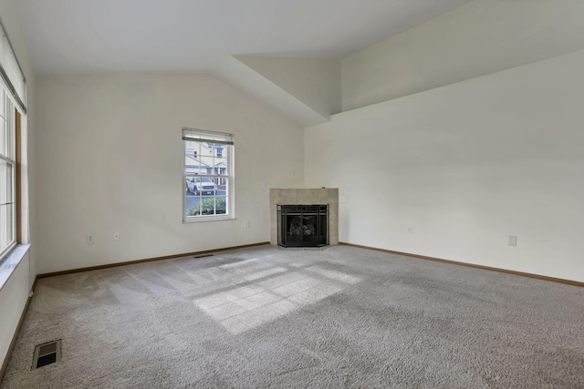 6010 Acropolis Way, Columbus, OH 43231 - unfurnished living room featuring carpet, a tiled fireplace, vaulted ceiling, and baseboards