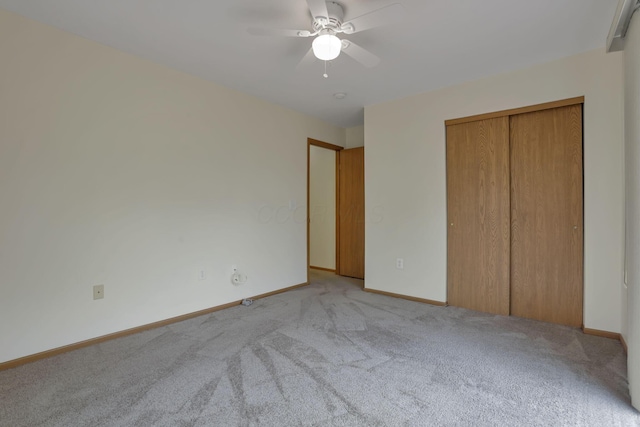 6010 Acropolis Way, Columbus, OH 43231 - unfurnished bedroom featuring light colored carpet, baseboards, a closet, and ceiling fan