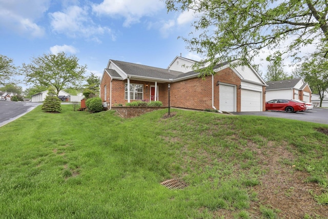 6010 Acropolis Way, Columbus, OH 43231 - ranch-style home with brick siding, asphalt driveway, an attached garage, and a front lawn