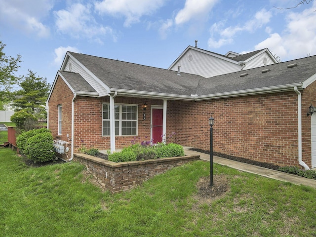 6010 Acropolis Way, Columbus, OH 43231 - view of front facade featuring a front lawn, brick siding, and roof with shingles