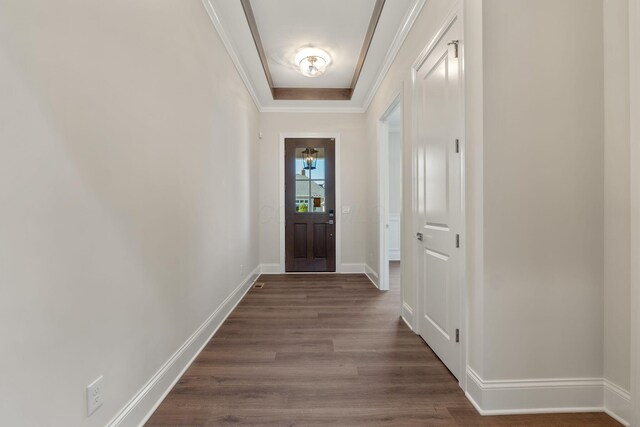 1473 Dogwood Loop, Powell, OH 43065 - doorway featuring dark wood-type flooring, crown molding, and baseboards