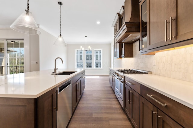 1473 Dogwood Loop, Powell, OH 43065 - kitchen featuring a sink, stainless steel appliances, premium range hood, dark wood-style flooring, and backsplash