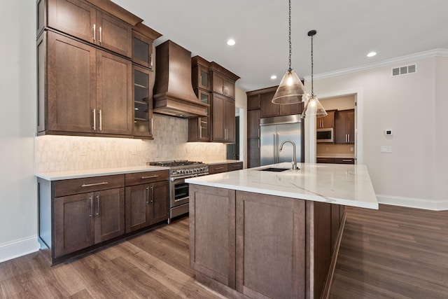 1473 Dogwood Loop, Powell, OH 43065 - kitchen featuring custom range hood, high quality appliances, baseboards, dark wood-style flooring, and crown molding