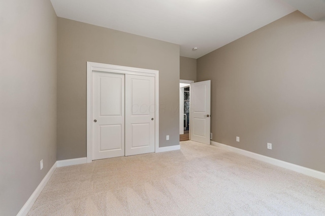 1473 Dogwood Loop, Powell, OH 43065 - unfurnished bedroom featuring light carpet, a closet, and baseboards