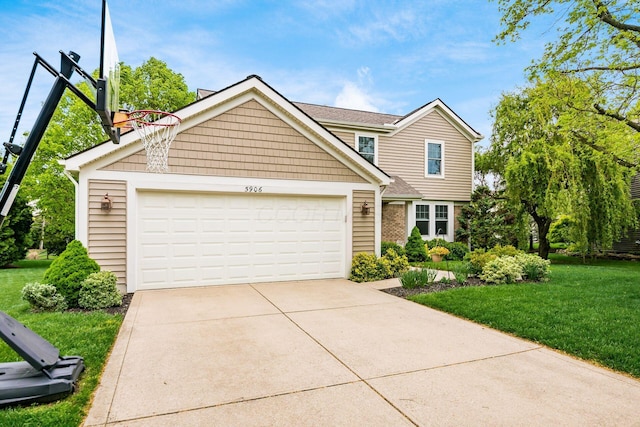 traditional-style house with a front yard, driveway, and an attached garage