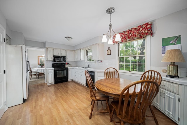 dining room featuring light wood-style floors