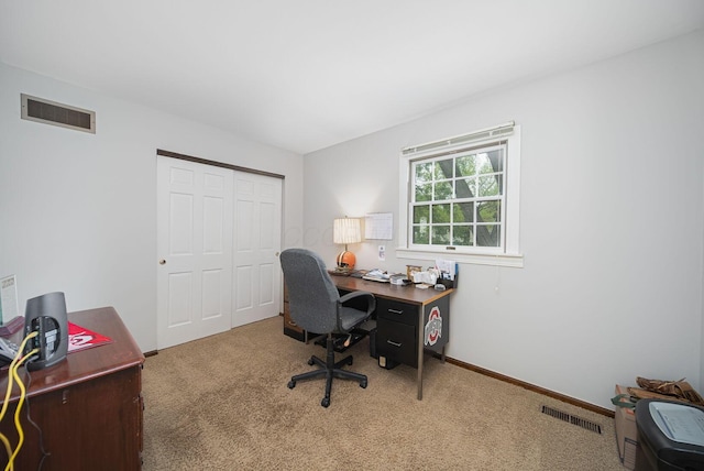 office with carpet flooring and baseboards