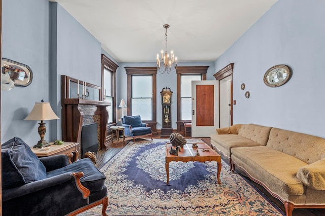 1205 Bryden Rd Unit 7, Columbus, OH 43205 - living area with a chandelier, wood finished floors, and a glass covered fireplace