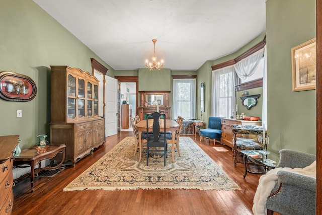1205 Bryden Rd Unit 7, Columbus, OH 43205 - dining area featuring dark wood finished floors and a chandelier