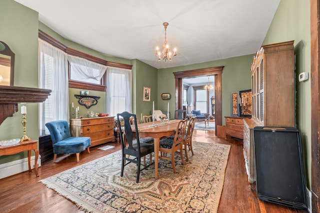 1205 Bryden Rd Unit 7, Columbus, OH 43205 - dining space with a chandelier and wood finished floors