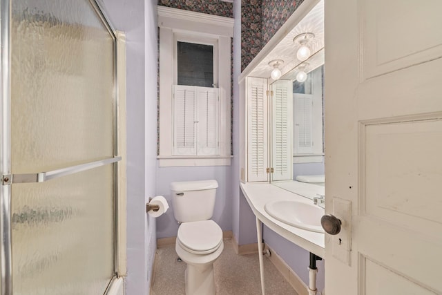 1205 Bryden Rd Unit 7, Columbus, OH 43205 - bathroom with baseboards, a shower stall, toilet, and vanity