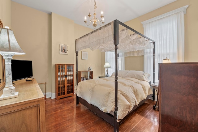1205 Bryden Rd Unit 7, Columbus, OH 43205 - bedroom featuring a chandelier and dark wood-style floors
