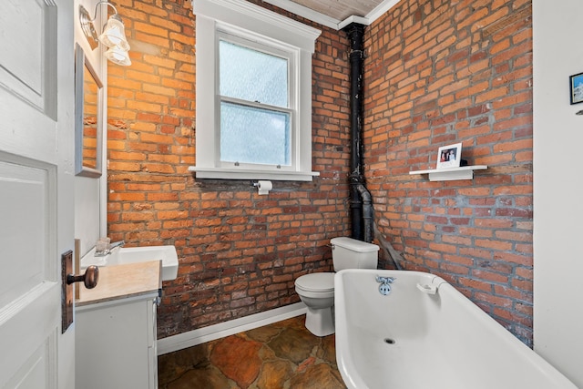 1205 Bryden Rd Unit 7, Columbus, OH 43205 - bathroom featuring toilet, brick wall, a bath, crown molding, and baseboards