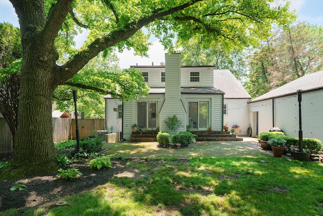 1660 Ridgeway Pl, Columbus, OH 43212 - back of house with entry steps, a chimney, and roof with shingles
