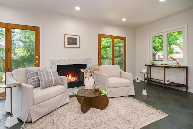 1660 Ridgeway Pl, Columbus, OH 43212 - living area featuring a fireplace with flush hearth, recessed lighting, and dark tile patterned flooring