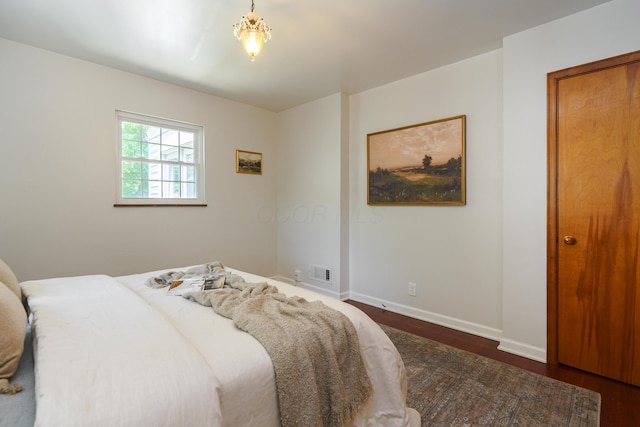 1660 Ridgeway Pl, Columbus, OH 43212 - bedroom with dark wood finished floors and baseboards