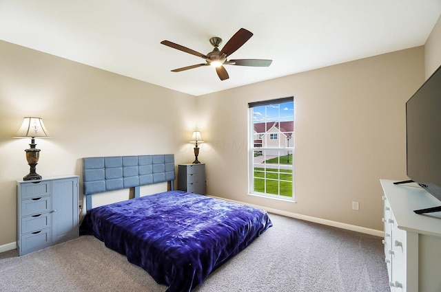bedroom with carpet flooring, baseboards, and ceiling fan
