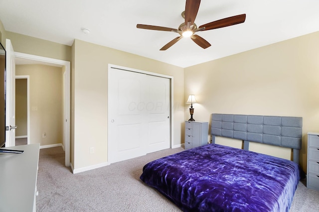 carpeted bedroom with baseboards and ceiling fan