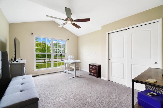 carpeted home office featuring ceiling fan, lofted ceiling, and baseboards