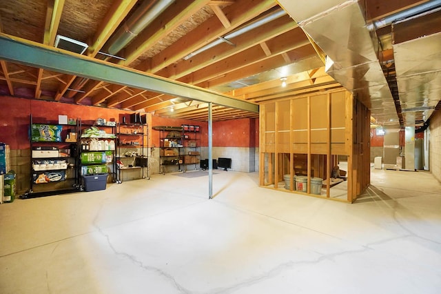 unfinished below grade area featuring heating unit