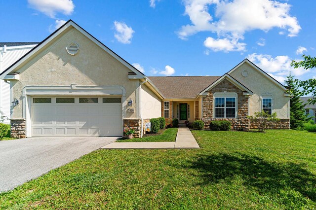 2826 Crosshurst Ct, Grove City, OH 43123 - view of front of house featuring stone siding, stucco siding, and driveway