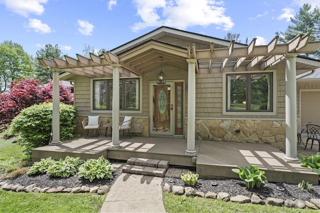 2825 Kings Corners Rd E, Mansfield, OH 44904 - view of front of home featuring stone siding and a pergola