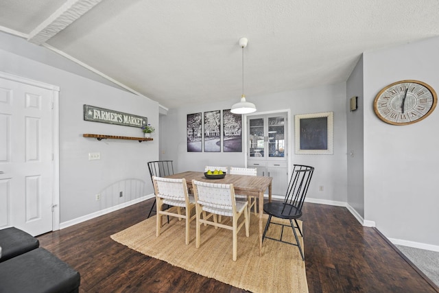 2825 Kings Corners Rd E, Mansfield, OH 44904 - dining area featuring baseboards, wood finished floors, and lofted ceiling