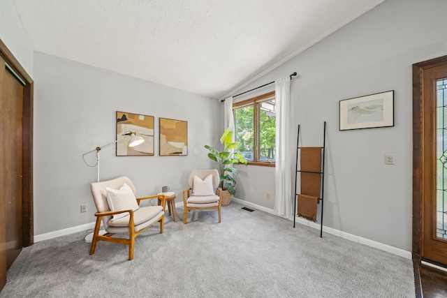 2825 Kings Corners Rd E, Mansfield, OH 44904 - sitting room with vaulted ceiling, a textured ceiling, baseboards, and carpet