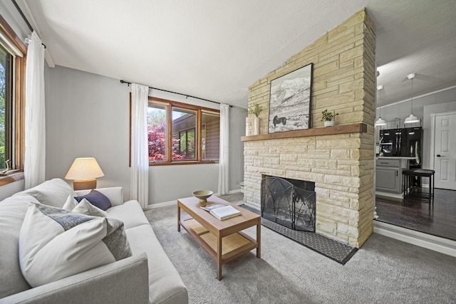 2825 Kings Corners Rd E, Mansfield, OH 44904 - living area with a fireplace, carpet, vaulted ceiling, and baseboards