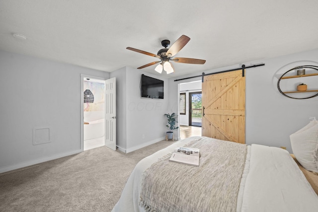 2825 Kings Corners Rd E, Mansfield, OH 44904 - bedroom with light carpet, a barn door, baseboards, connected bathroom, and ceiling fan
