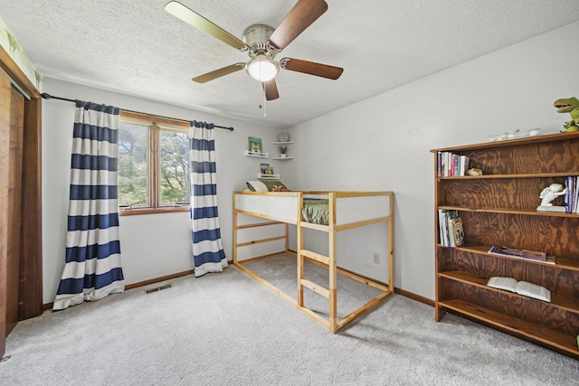 2825 Kings Corners Rd E, Mansfield, OH 44904 - carpeted bedroom featuring a textured ceiling, baseboards, and a ceiling fan