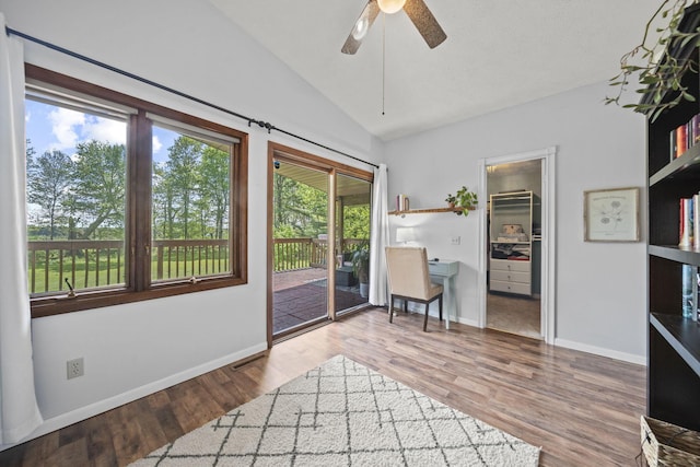 2825 Kings Corners Rd E, Mansfield, OH 44904 - living area featuring lofted ceiling, a ceiling fan, wood finished floors, and baseboards
