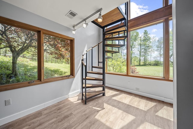2825 Kings Corners Rd E, Mansfield, OH 44904 - stairs with wood finished floors, baseboards, and rail lighting