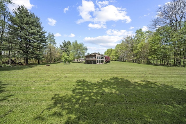 2825 Kings Corners Rd E, Mansfield, OH 44904 - view of grassy yard featuring a wooded view