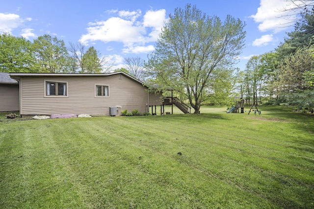 2825 Kings Corners Rd E, Mansfield, OH 44904 - view of grassy yard with a playground and stairway