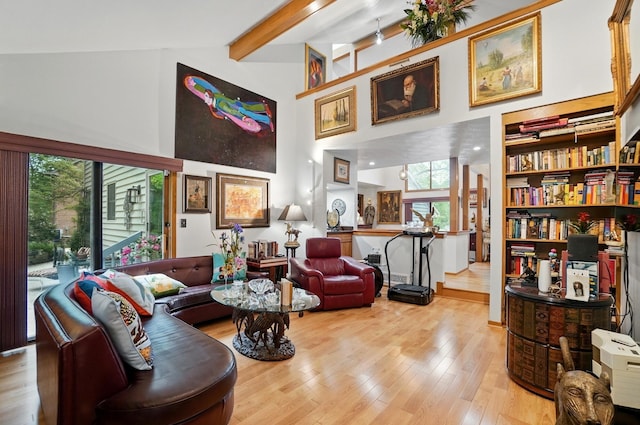8292 Breckenridge Way, Columbus, OH 43235 - living area with beamed ceiling, light wood-type flooring, and a towering ceiling