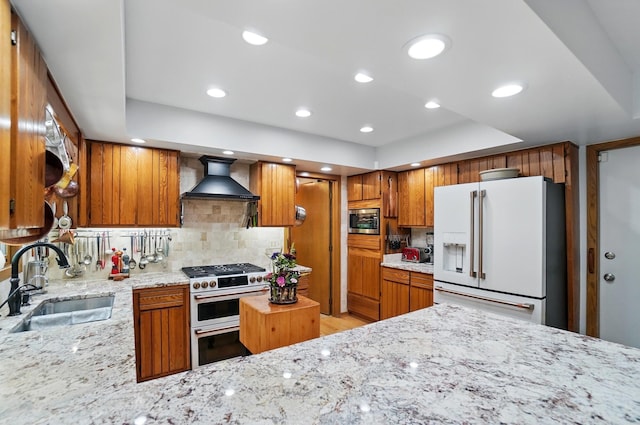8292 Breckenridge Way, Columbus, OH 43235 - kitchen with appliances with stainless steel finishes, wall chimney exhaust hood, light stone countertops, brown cabinets, and decorative backsplash