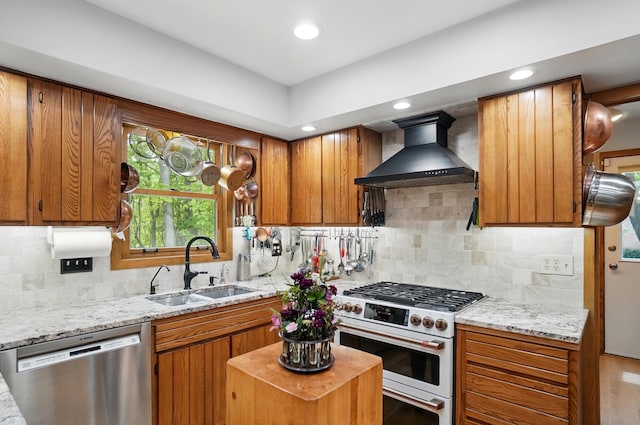 8292 Breckenridge Way, Columbus, OH 43235 - kitchen featuring dishwasher, wall chimney exhaust hood, gas range oven, brown cabinetry, and backsplash