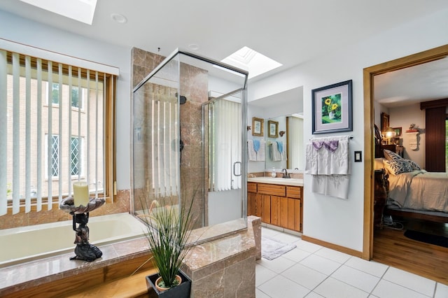 8292 Breckenridge Way, Columbus, OH 43235 - bathroom featuring a skylight, ensuite bathroom, a bath, and vanity