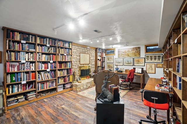 8292 Breckenridge Way, Columbus, OH 43235 - office area with rail lighting, a fireplace, and wood finished floors